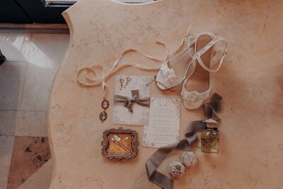 A wedding details flat lay photo taken at Lakewood Ranch Country Club, a wedding venue in Sarasota, Florida by preferred vendor Angela Moon Photography. 