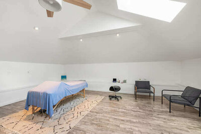 Small PT session area with functional equipment and open floor space