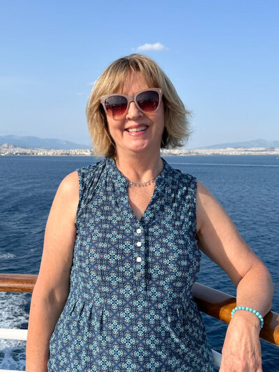 woman in greece in front of water