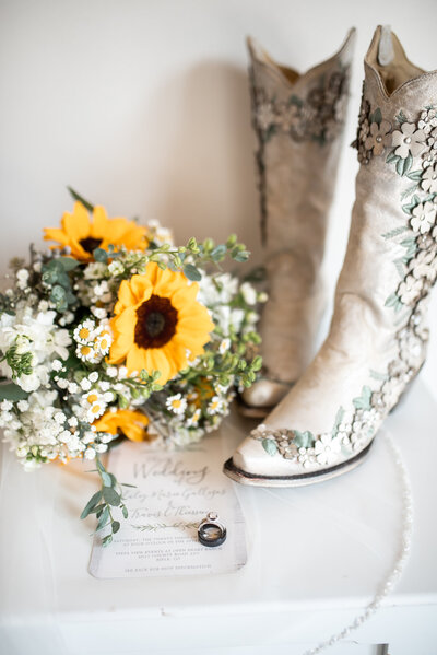 Boots and sunflower bouquet