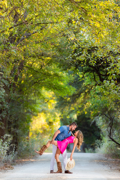 Dallas texas couple dipping underneath arching trees
