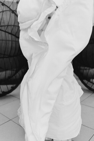Bride laughs with her mother at her wedding