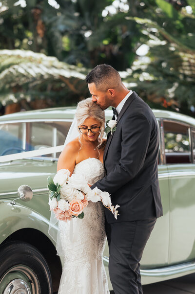 Couple exchanging vows under a floral arch during a Sydney wedding