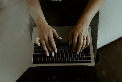 woman typing on computer