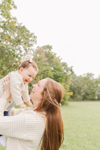 Mom holds daughter during Family photo session with Sara Sniderman Photography in natick Massachusetts