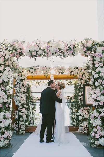 flower filled chuppah for jewish ceremony