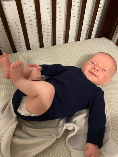 This newborn learned to fall asleep in his crib independently.
