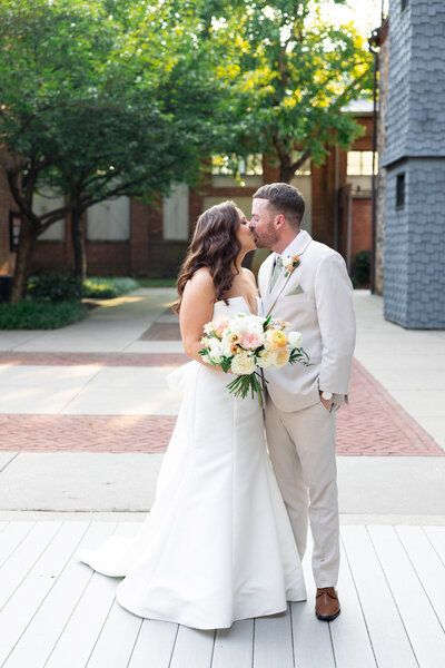 Bride and groom share a kiss at Mt. Washington Mill Dye House