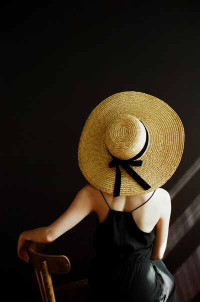 fashionable woman wearing a big straw hat