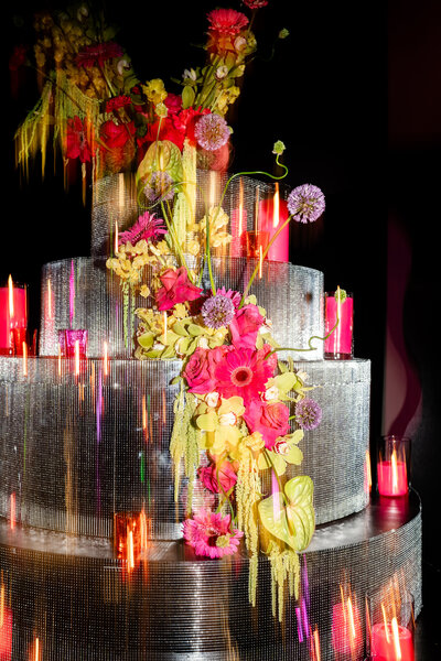 Floral and candle display at wedding planned by Bloom & Blueprint