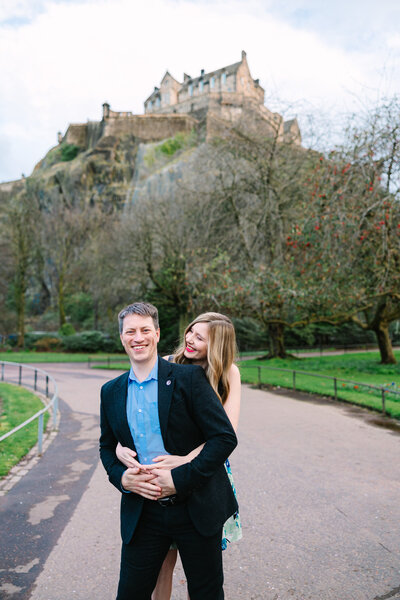 wedding photographer in Edinburgh captures couple smiling in Princes Street Gardens