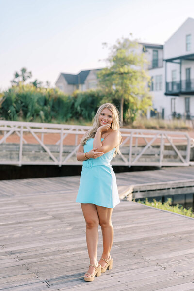 high school senior girl laughing during gold hour session | DFW senior photographer