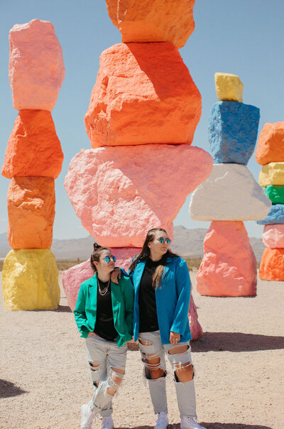 Girls posing in rainbow rocks.