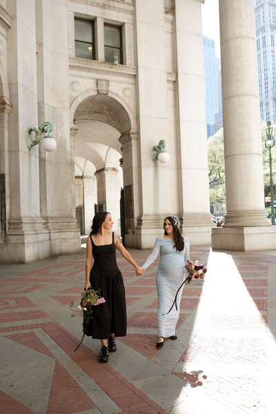 NYC spring city hall elopement two brides with sandy liang dress and bouquets