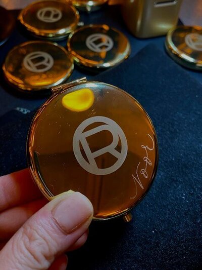 gold mirror with engraved name