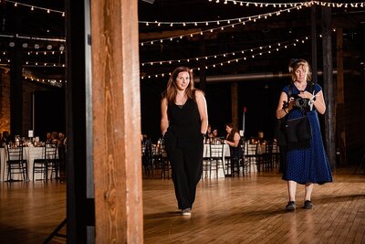 Photographer and Assistant on the dance floor of Cannery ONE modeling for a test photo of lighting