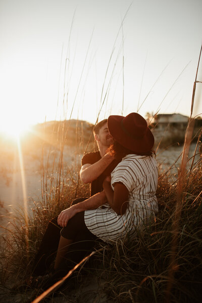 couple in love on tybee beach with the sunset