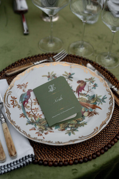 Custom menu books for a Dallas wedding, sitting on velvet linens