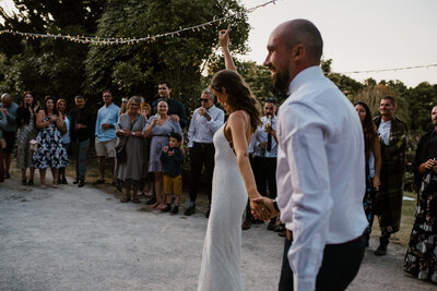 Alkina and Jaron entering their wedding reception and photographed by aimee kelly photography in new plymouth