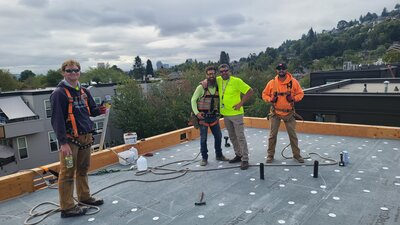 Flatline roofing team working on a new project in Vancouver, WA