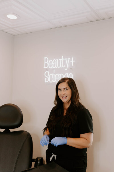 Laura Hala owner of Beauty in Science Medspa in treatment room