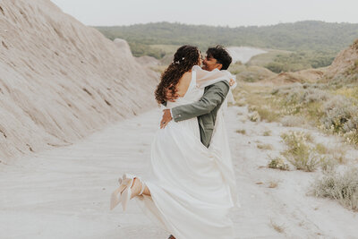 A bride and groom celebrating their recent intimate wedding in Claybanks, SK