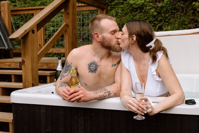 Couple kissing in a hot tub.