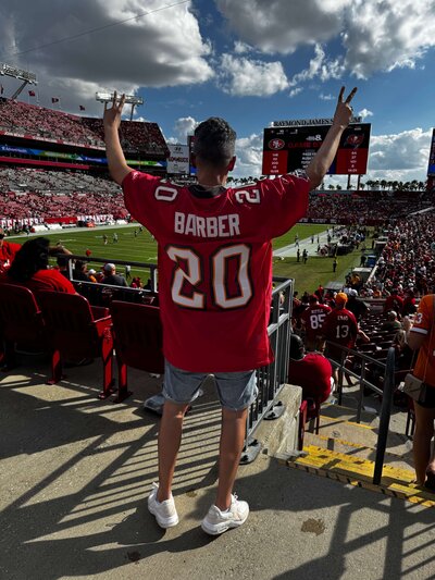 Marcia Enjoying a Tampa Bay Buccaneers NFL football game. 