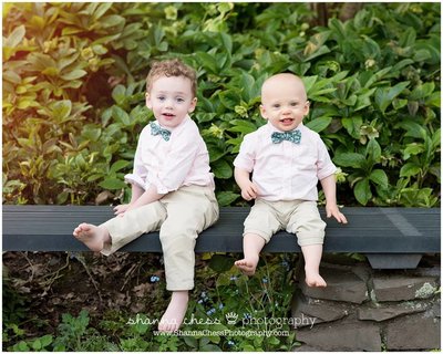 Boys in bow ties | Wearing pink long sleeved button up shirts, bow ties, and barefoot in the park