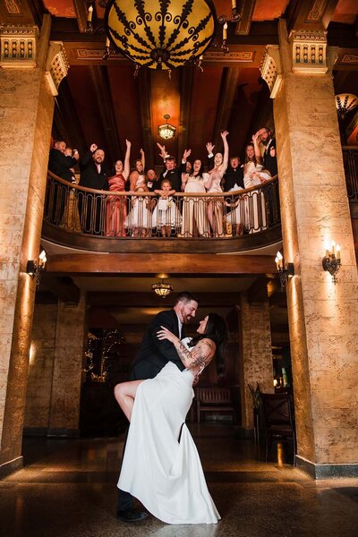 A bride and groom dance in the at there joyful wedding reception in Montana.