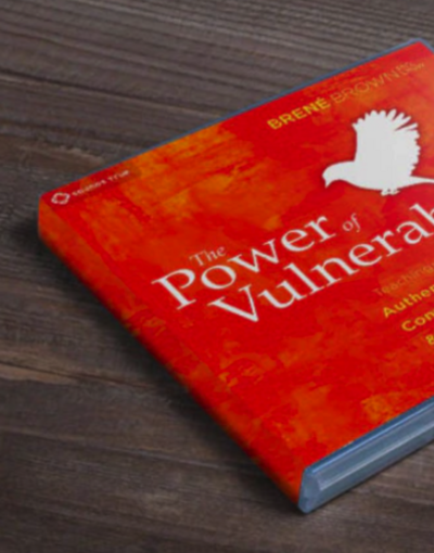 The Power of Vulnerability book sitting on a wood table