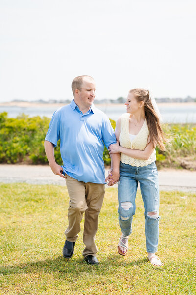 Candid ocean engagement portraits in New England with relaxed emotional storytelling.