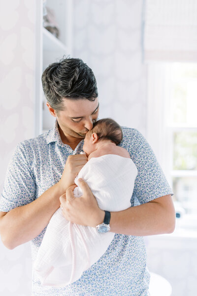 newborn baby posed in blanket