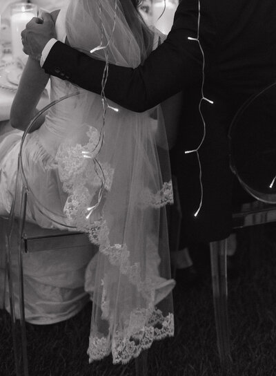 Couples photographer located in Rexburg Idaho. An engaged couples smiles at the camera, the man looking at his fiance and the woman is looking at the camera.