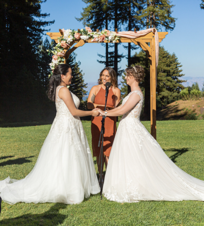 lesbian wedding ceremony two brides with lgbtq wedding officiant