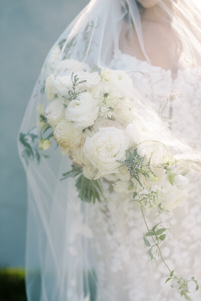 close up of Indianapolis bride holding bouquet under veil