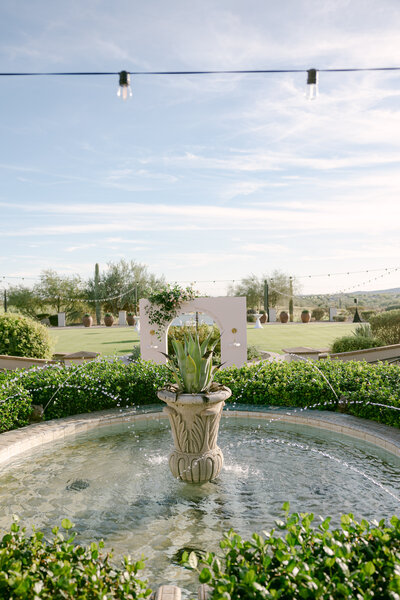 Groom poses for photo as he walks on the balcony of this Southern California Wedding Venue at Jeune Perche. 
