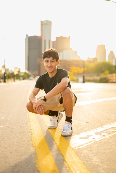Senior photoshoot in downtown Detroit with urban backdrop.