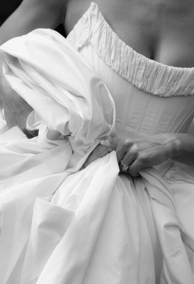 A couple stand on a cliff overlooking the Oregon Coast