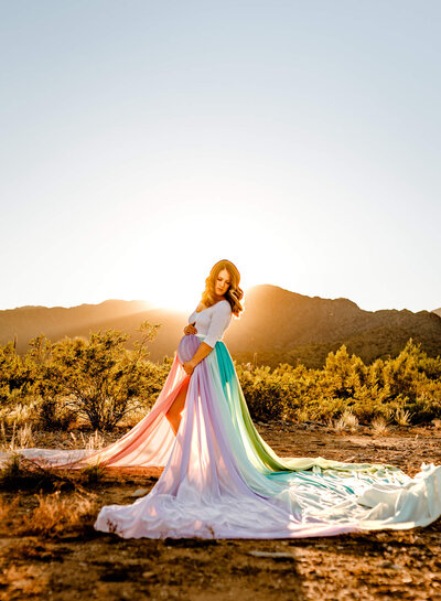 Arizona mom holding her belly for her rainbow baby maternity session in Arizona with photographer Cactus & Pine Photography LLC