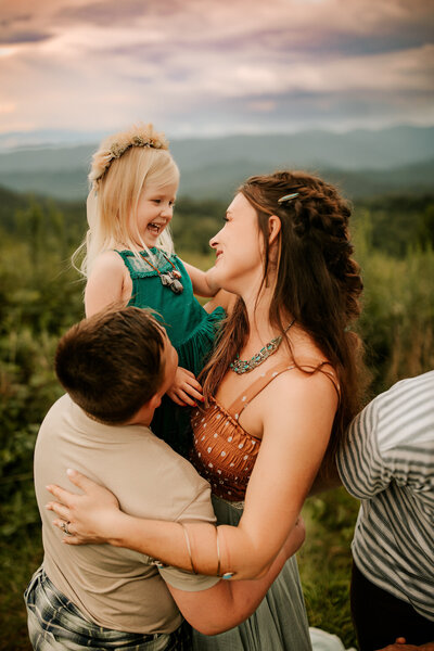 mother hugging daughters