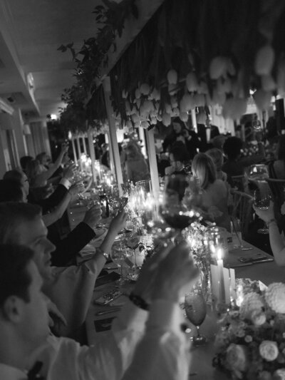 Guests celebrating at a reception in black and white