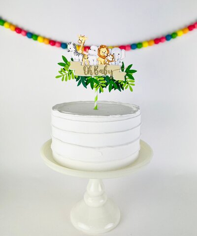 Jungle theme baby shower cake topper with lions, monkeys, zebra