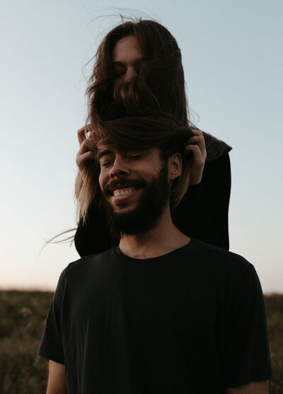 Livia and Sam photographed in a dreamy and romantic couples session in Saskatoon, highlighting playful and emotional moments.