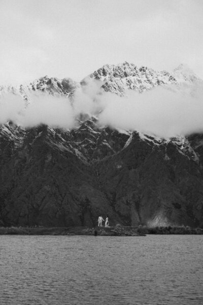Bride and groom with mountains behind them at their Queenstown elopement
