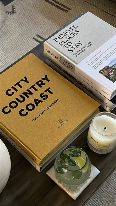 Books on a coffee table in Twin Cities vintage home