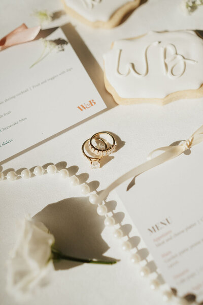 wedding flatlay with custom menu cards and florals