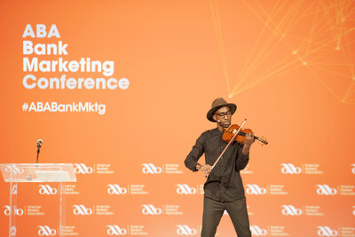 A photo of an orange backdrop at a conference