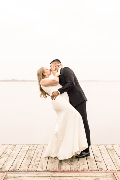 Bride and groom kissing on wedding day
