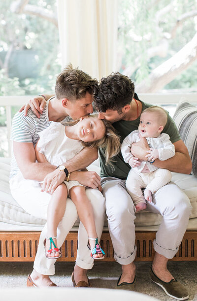 Couple pose with toddler and baby